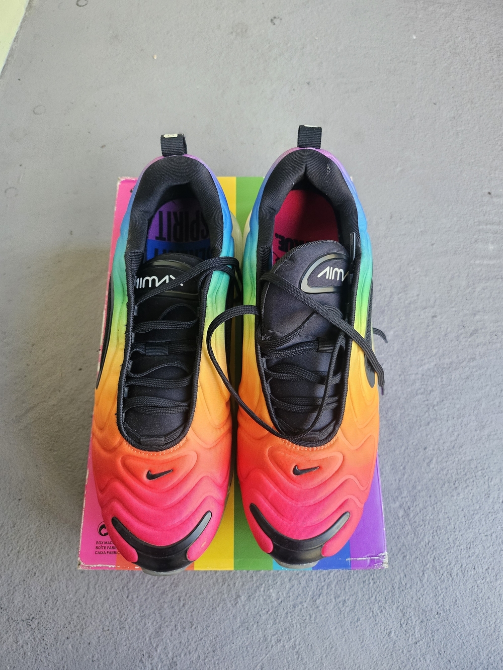 Nike Air Max 720 "Be True" sneakers, featuring a vibrant rainbow gradient upper.
